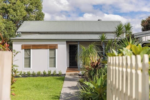 Surrounded by lush lawn and greenery, this single-level home offers privacy, essentials, and easy access to some of the region’s pristine beaches, shopping, and nature.