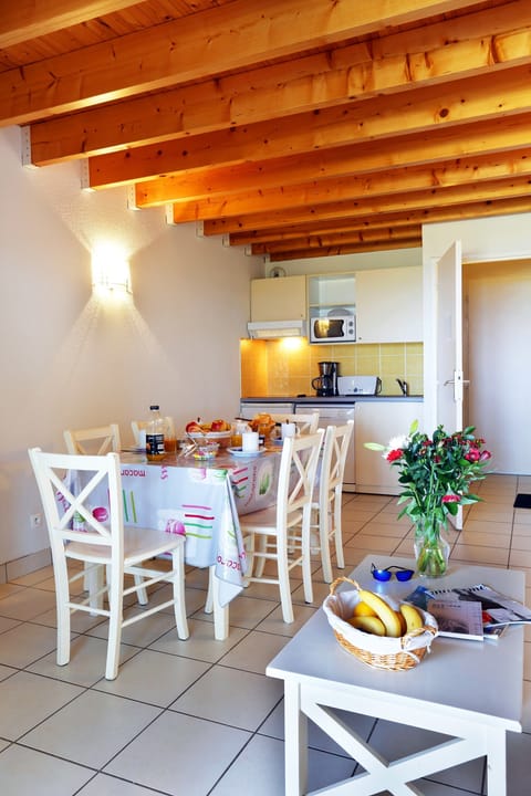 Prepare meals in the kitchenette and enjoy them at the dining table.