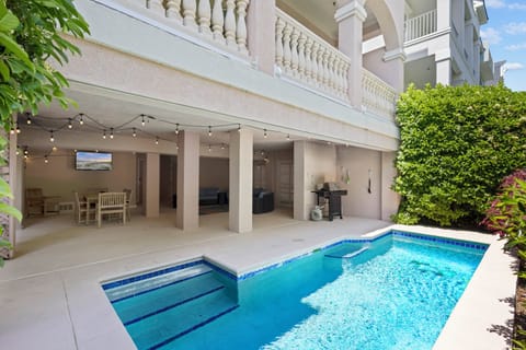 HOST & HOME presents… 21 Crabline Court! Private Pool Oasis: Relax poolside under a covered patio complete with plush furniture, smart TV, BBQ grill with al fresco dining options.