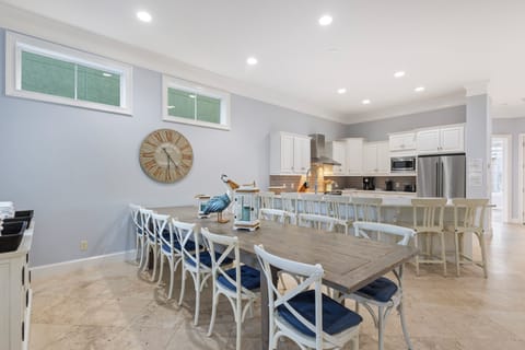 Dining & Entertaining: A dining table for 12 guests, a kitchen bar accommodating 7, and multiple balconies with more seating for sunset cocktails.