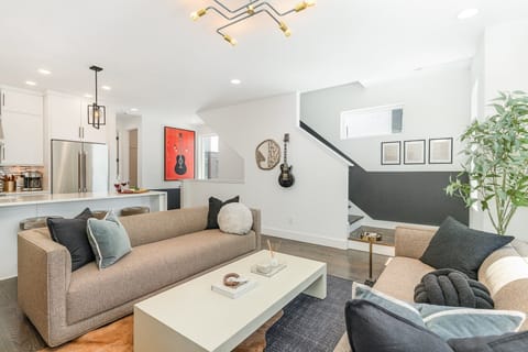 2nd Floor: Bright, inviting Living Room with modern décor, ample natural light, and a comfortable layout that's ideal for entertaining or relaxing.