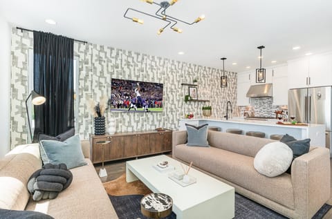 2nd Floor: Bright, inviting Living Room with modern décor, ample natural light, and a comfortable layout that's ideal for entertaining or relaxing.