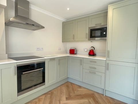 The new stylish kitchen has everything you need to cook up a storm with a fridge/ freezer, oven, dishwasher, microwave and integrated bin.