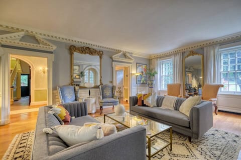 Elegantly furnished living room featuring a classic piano — perfect for relaxing or gathering with friends and family.