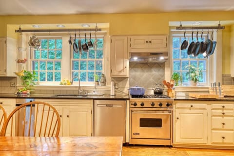 The kitchen is fully equipped with high-quality cookware, utensils, and all the essentials for preparing meals with ease — highlighted by a professional-grade Viking stove for the culinary enthusiast.