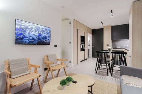 Experience modern comfort in this stylish open-plan living area, perfect for relaxing and dining with ease.