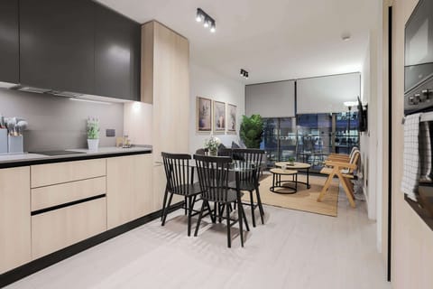 Experience modern elegance in this stylish kitchen and dining area, perfect for cozy dinners and entertaining.