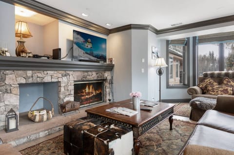 Spacious Living Room with Wood Burning Fireplace and Views of Beaver Creek Slopes
