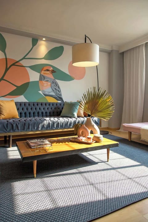 There's a plush sofa and a Smart TV