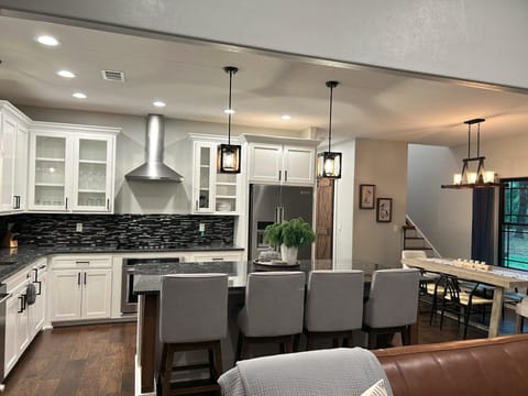 The Heart of the Home: a chef's kitchen with s/s appliances and seatings