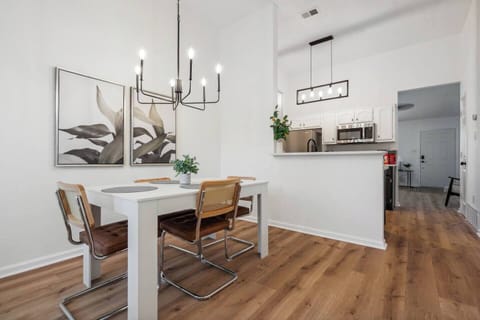 Gather in the bright and spacious dining area, where a large window offer a lovely view of the backyard.