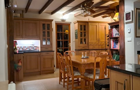 Kitchen table and drinks area plus dry pantry storage