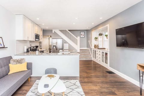 Each living room has a stylish sectional with 55" smart TV