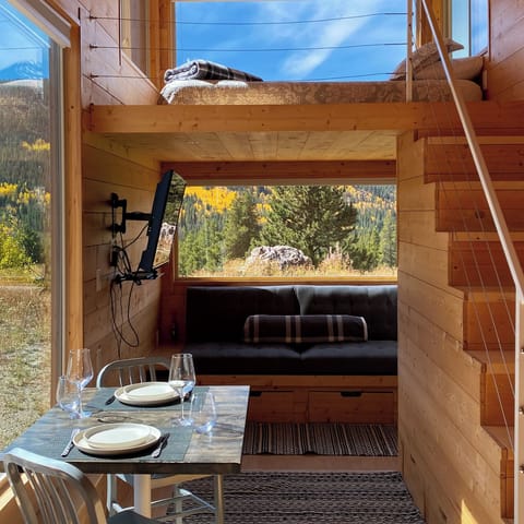 Looking from kitchen/dining area toward living room and sleeping loft
