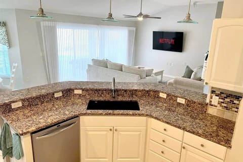 The open concept kitchen allows you to cook while entertaining guests. 