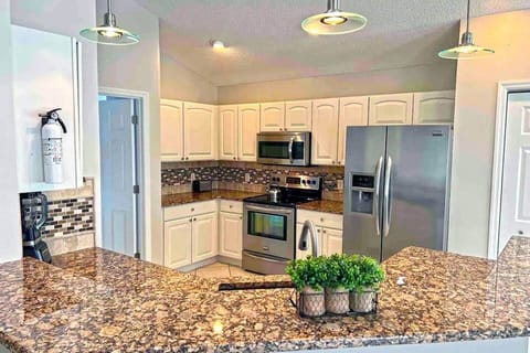 The fully stocked kitchen with Granite Countertop.
