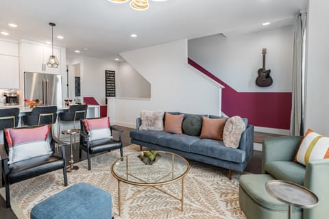 2nd Floor: Bright and colorful open-concept living area featuring a Smart TV and stylish furnishings.