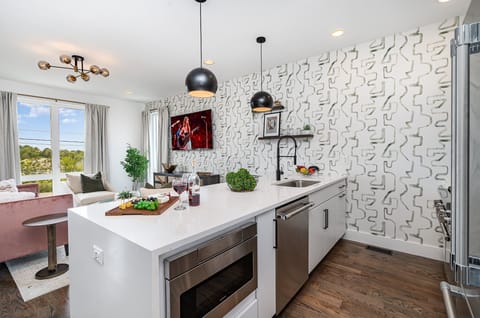 Fully equipped kitchen with stainless steel appliances and a kitchen island with seating for 4 guests. (2nd Floor)