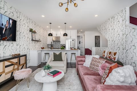 Open-floor living space featuring a smart TV and designer furnishings. (2nd Floor)