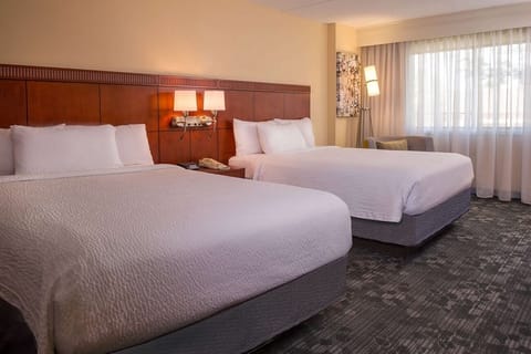 Drift off comfortably in a serene double-queen guest room.