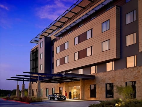 Arrive to a sleek, well-lit entrance after a long day