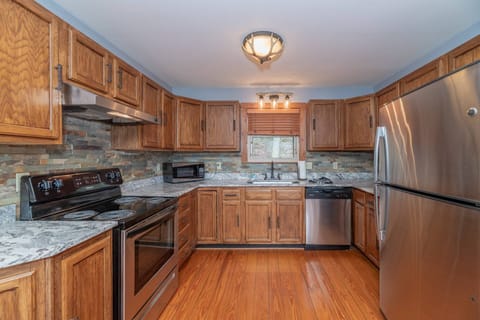The kitchen comes fully equipped and updated with stainless appliances