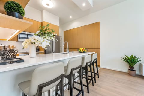 Enhance your dining experience with the kitchen island and barstool seating.