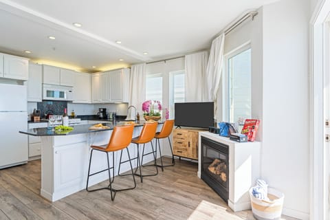 Cozy up by the fireplace and enjoy the perfect touch of warmth and relaxation.