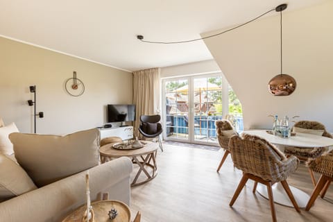 Bright Living Room with Sofa and Dining Area