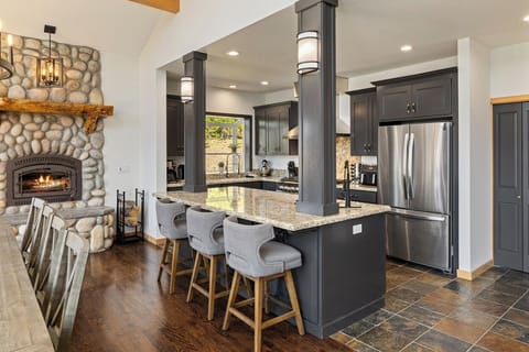 Luxury kitchen, island seating 3, and pro-grade appliances, wood burning fireplace