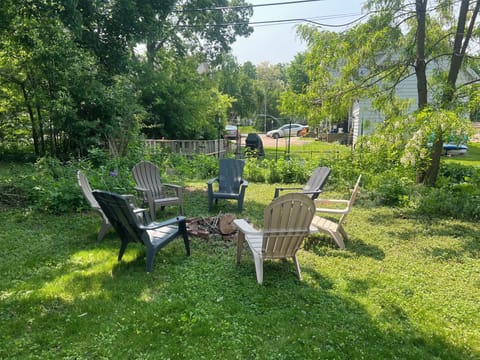 Backyard bonfire pit with 7 chairs. 