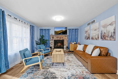 Living room with comfortable seating, propane fireplace, smart TV