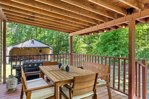 Outdoor seating with 4-burner gas grill and propane included.