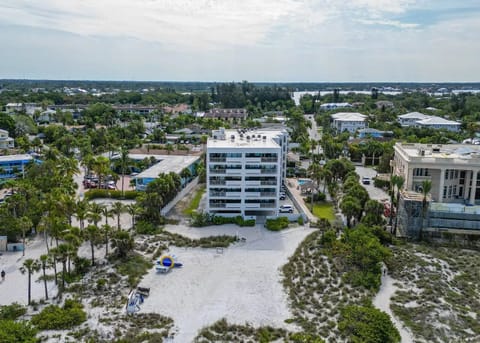 Aerial View of Siesta Sands Beach Resort tower from the beach