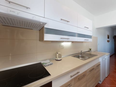 Furniture, Wood, Interior Design, Cabinetry, Kitchen, Flooring, Countertop, Cupboard, Room, Wood Stain