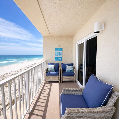 Balcony off open concept living room facing the beach and the ocean