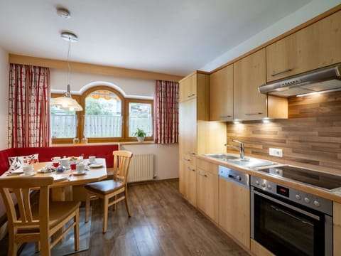 Interior Design, Flooring, Floor, Kitchen, Ceiling, Apartment, Room, Countertop, Cabinetry, Wood Stain