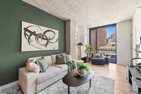 Bright living area w/ comfy seating, art accents, and natural light that makes it easy to relax or gather.
