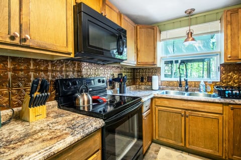 Full kitchen includes stove top, oven, microwave, dishwasher, refrigerator, and more!