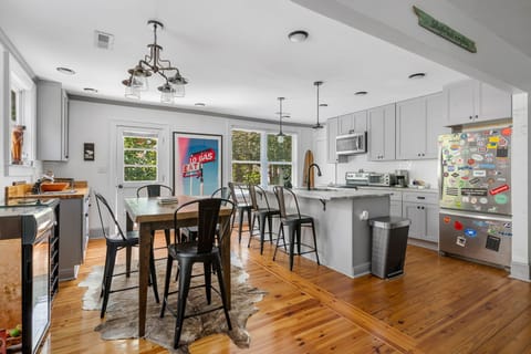 Open Concept Dining Room and Kitchen | Shep Shack | IOP Escapes Vacation Rentals | 406 Palm Blvd Isle of Palms SC