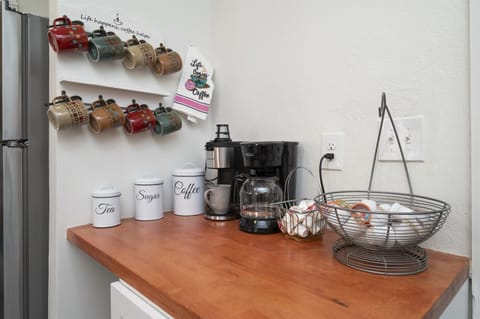 Enjoy your morning at the kitchen's inviting coffee station, perfect for coffee lovers.