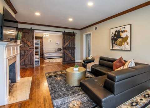 Our charming living room at the Glen Iris Garden Haven is a cozy and inviting space where you can relax and unwind after a day of exploring. Get in touch to explore our custom concierge services and local experiences curated just for you. 