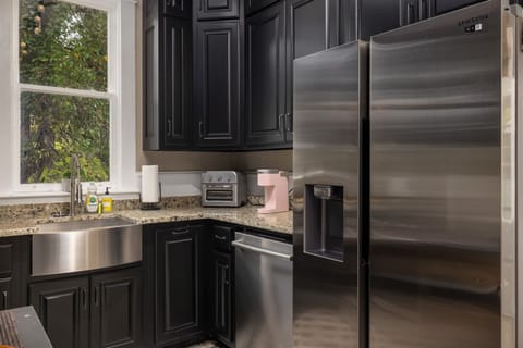 Prepare meals in our modern kitchen, equipped with sleek stainless steel appliances for your culinary convenience. Reach out to us for our personalized concierge services and handpicked local experiences. 