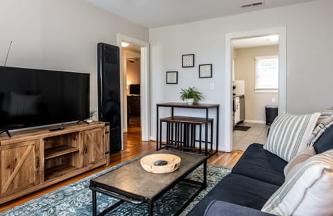 Alternate view of the bright living room with open layout and thoughtful decor touches