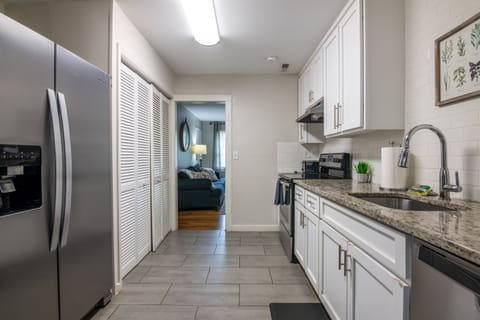 Modern galley kitchen with sleek countertops, full-size appliances, and a clean, practical layout.
