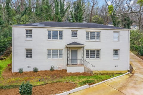 Charming and modern, the freshly painted white brick exterior of Vulcan View Suites is nestled in a serene, tree-lined neighborhood. The building's clean lines and landscaped surroundings create a welcoming first impression.