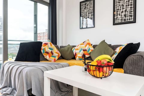 Cosy living room with a large french door leading to a balcony.