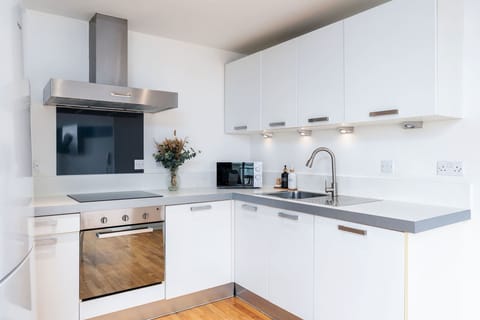 The fully equipped kitchen is ready for you to use.