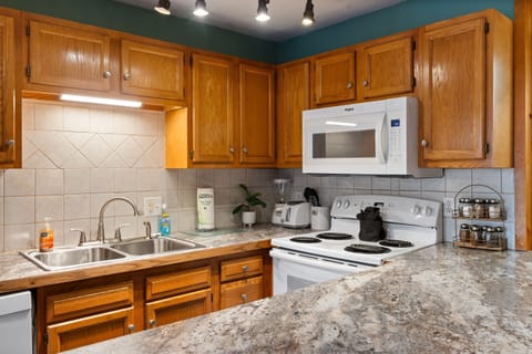 Sleek appliances meet warm hospitality in this well-equipped space