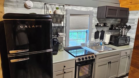 full kitchen. microwave, oven, k-cup coffee maker. refrigerator.